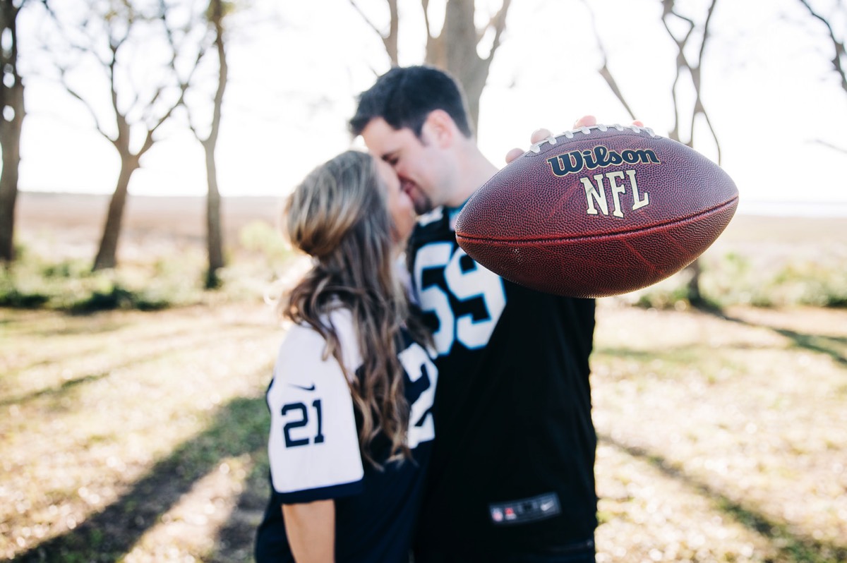 Fort Fisher Wedding Photographers  - fun engagement photo - football jerseys - Fort Fisher North Carolina -  Engagement Photography - Popular engagement photography locations - Lifestyle engagement photography -  Ft Fisher engagement photographers - Engagement session ideas - Trends in engagement photography - Chris Lang Photography - Engagement photos 