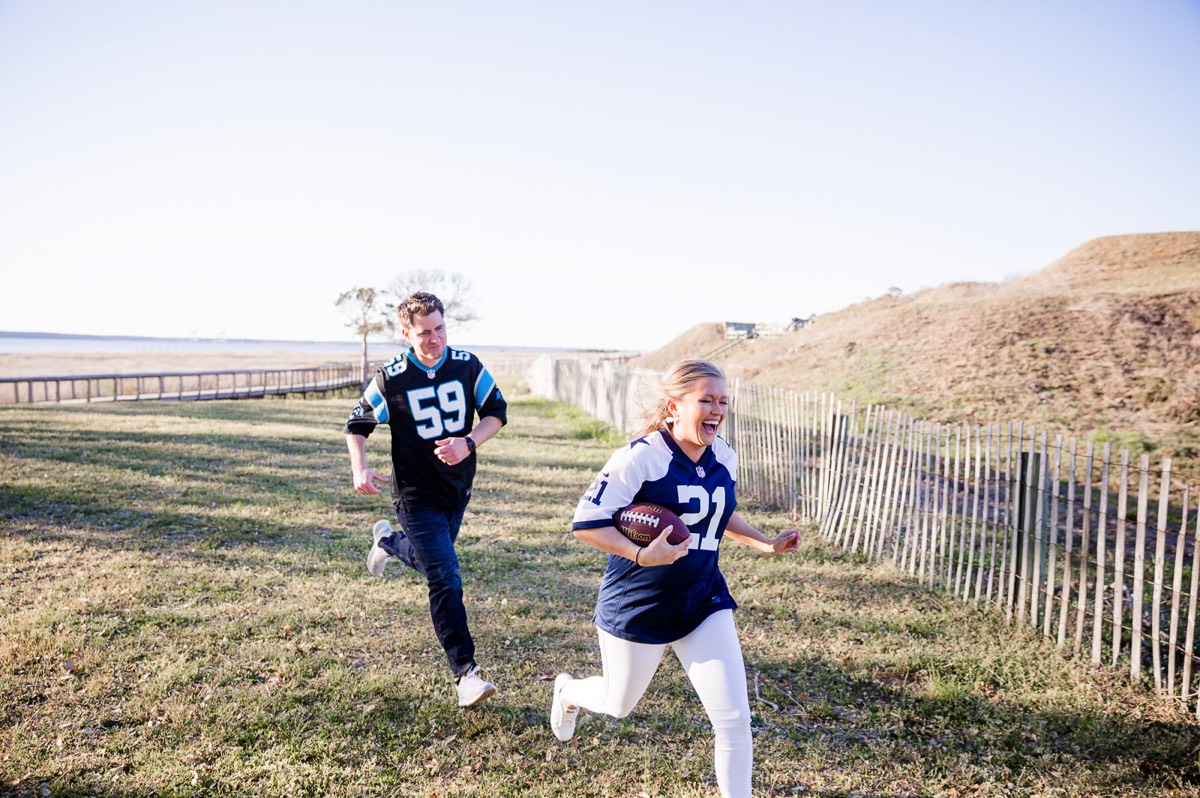 Fort Fisher Wedding Photographers  - Couple playing football - Fort Fisher North Carolina -  Engagement Photography - Popular engagement photography locations - Lifestyle engagement photography -  Ft Fisher engagement photographers - Engagement session ideas - Trends in engagement photography - Chris Lang Photography - Engagement photos 