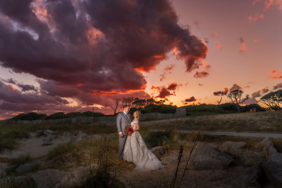 Fort Fisher Wedding Photographers - Ft Fisher Wedding Photography  - Sunset wedding photo of bride & groom at   Fort Fisher North Carolina -  Wedding Photography - Wedding Ideas - Bride - Groom - Wedding Dress - Chris Lang Photography- Popular wedding location - 