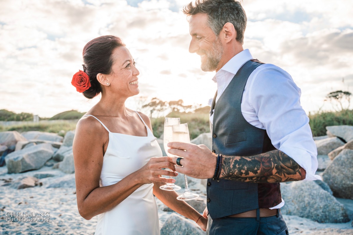 Fort Fisher Wedding Photographers - Ft Fisher Wedding Photography  - Bride & Groom  - Champagne Toast - Beach Wedding -  Fort Fisher North Carolina -  Wedding Photography - Wedding Ideas - Bride - Groom - Wedding Dress - Chris Lang Photography- Popular wedding location - 
