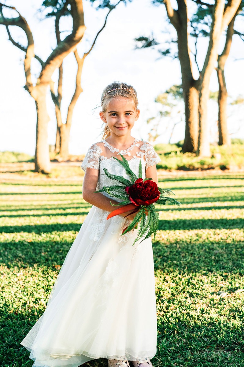 Fort Fisher Wedding Photographers - Ft Fisher Wedding Photography  - Flower girl - flower girl dress -  red flowers -   Fort Fisher North Carolina -  Wedding Photography - Wedding Ideas - Bride - Groom - Wedding Dress - Chris Lang Photography- Popular wedding location - 