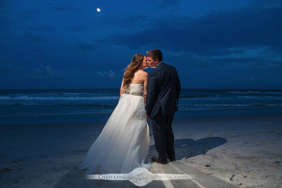 Wrightsville-Beach-Wedding-Photographers-Newly Weds on the beach kissing under a moon