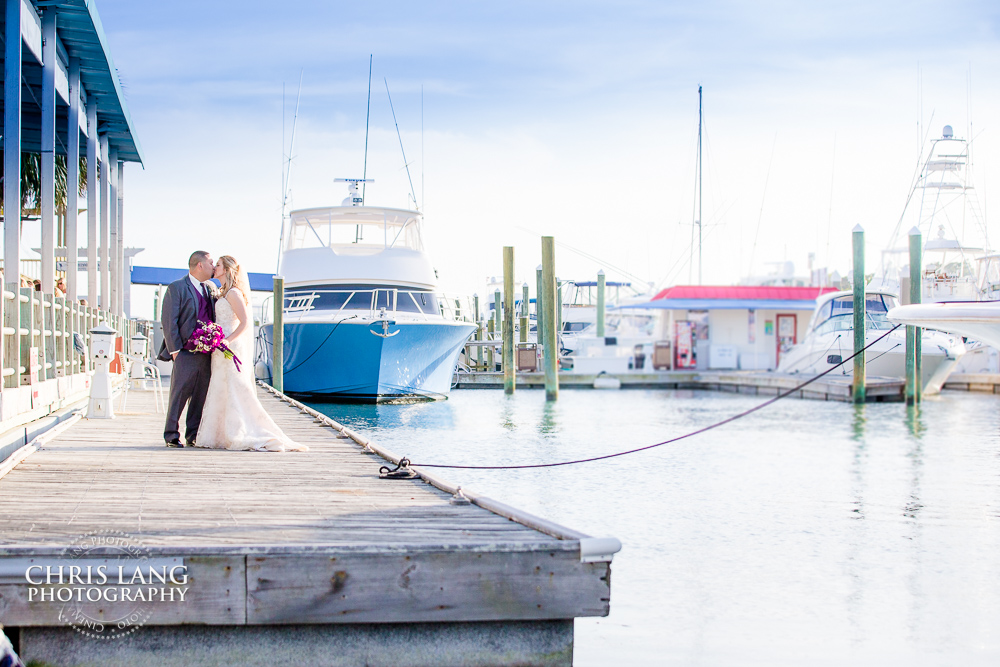 Blue water grill weddings - receptions - image of bride and groom on the dock