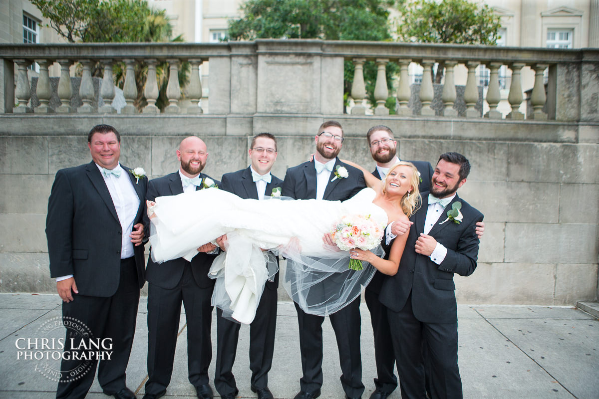 groomsmen with bridal bouguets - bridal party photos - bridesmaids - groomsmen -  bridal party photography ideas - wilmington nc wedding photography
