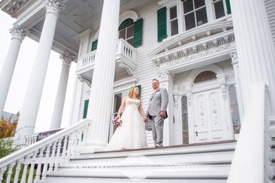 Wedding Couple standing on the steps of Bellamy Mansion - Wilmington NC Wedding Photography 