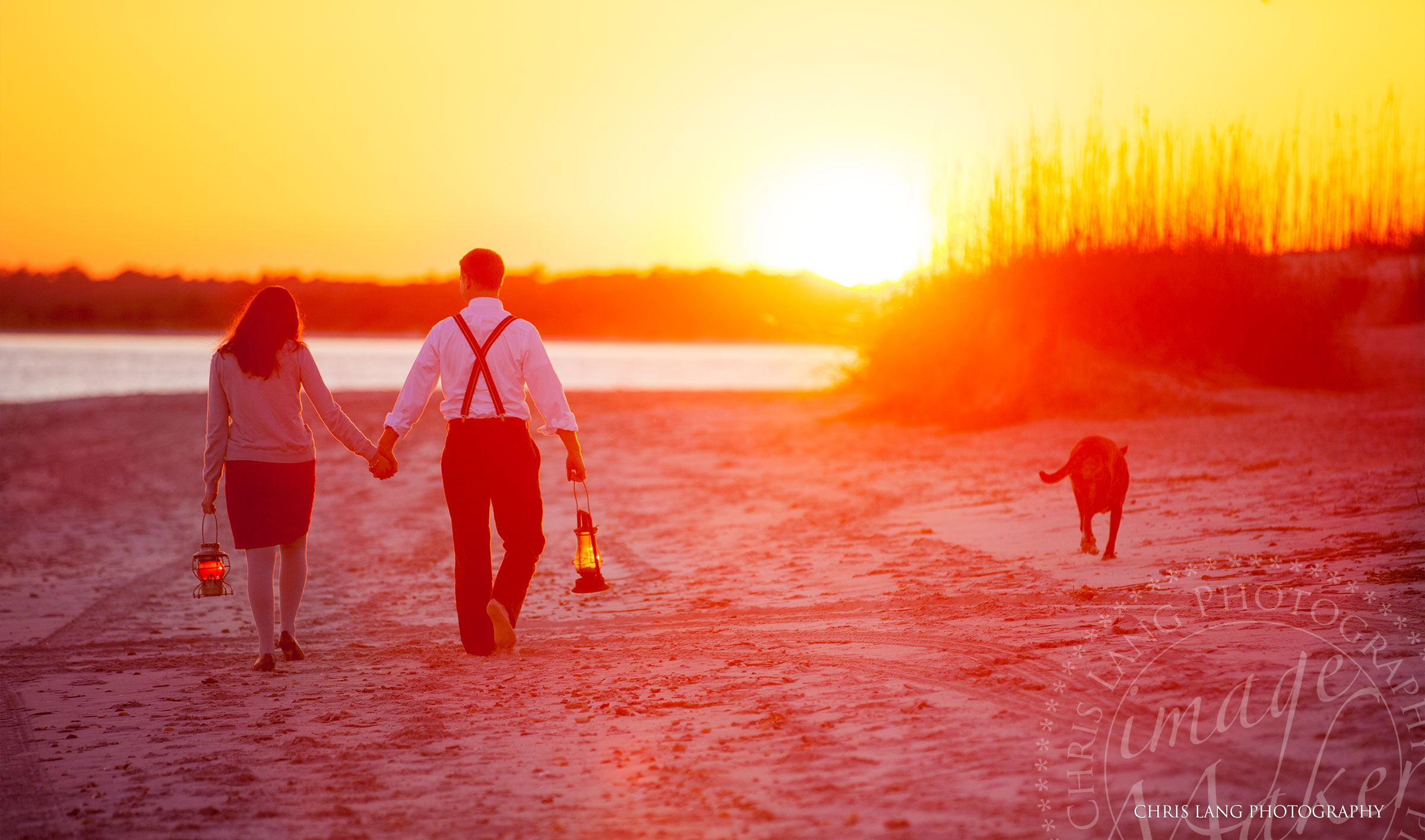 Engagement photographty session of couple walking a dog on the South End of Wrightsville Beach North Carolina.   Wrightsville Beach Engagement Photographers - Engagement picture ideas