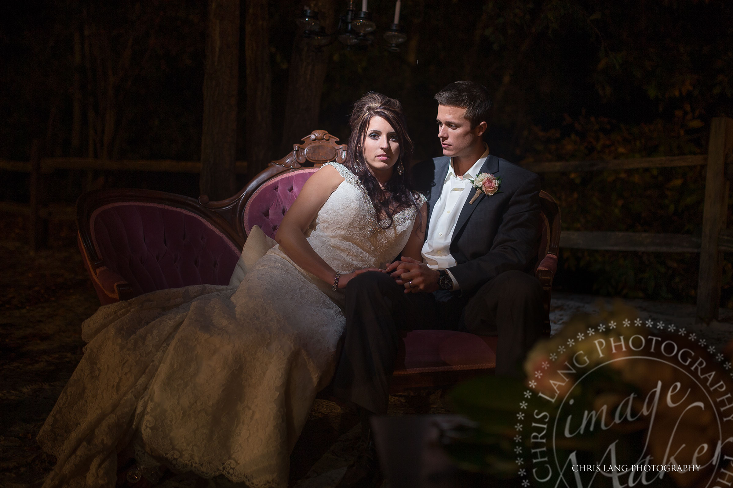 Romantic-Nighttime-Wedding-Picture-of-Bride-Groom-Sitting-on-a-Couch-at-River-Landing-River-Lodge-Wedding Picture Ideas