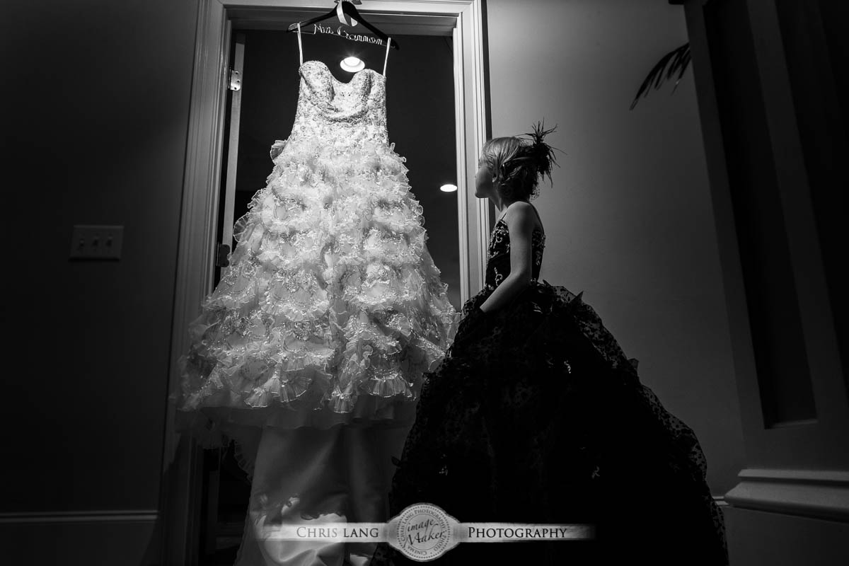 Real Weddings-Featured Wedding in Black and White-Wedding Ideas-Style-Trends-Wilmington NC Wedding Photographers-flower girl looking at wedding dress dreaming one day of being a bride