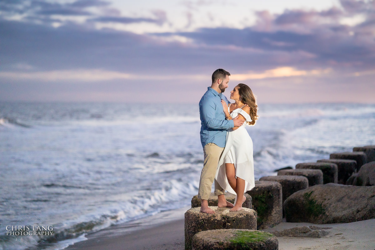 Fort Fisher Wedding Photographers  - Couple Photo on the beach at sunset - Fort Fisher North Carolina -  Engagement Photography - Popular engagement photography locations - Lifestyle engagement photography -  Ft Fisher engagement photographers - Engagement session ideas - Trends in engagement photography - Chris Lang Photography - Engagement photos 