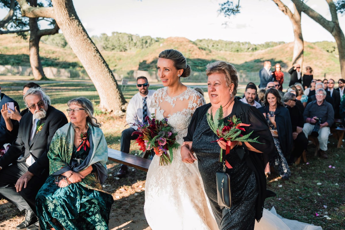 Fort Fisher Wedding Photographers - Ft Fisher Wedding Photography  - Bride walking down the islle - outdoor wedding -   Fort Fisher North Carolina -  Wedding Photography - Wedding Ideas - Bride - Groom - Wedding Dress - Chris Lang Photography- Popular wedding location - 