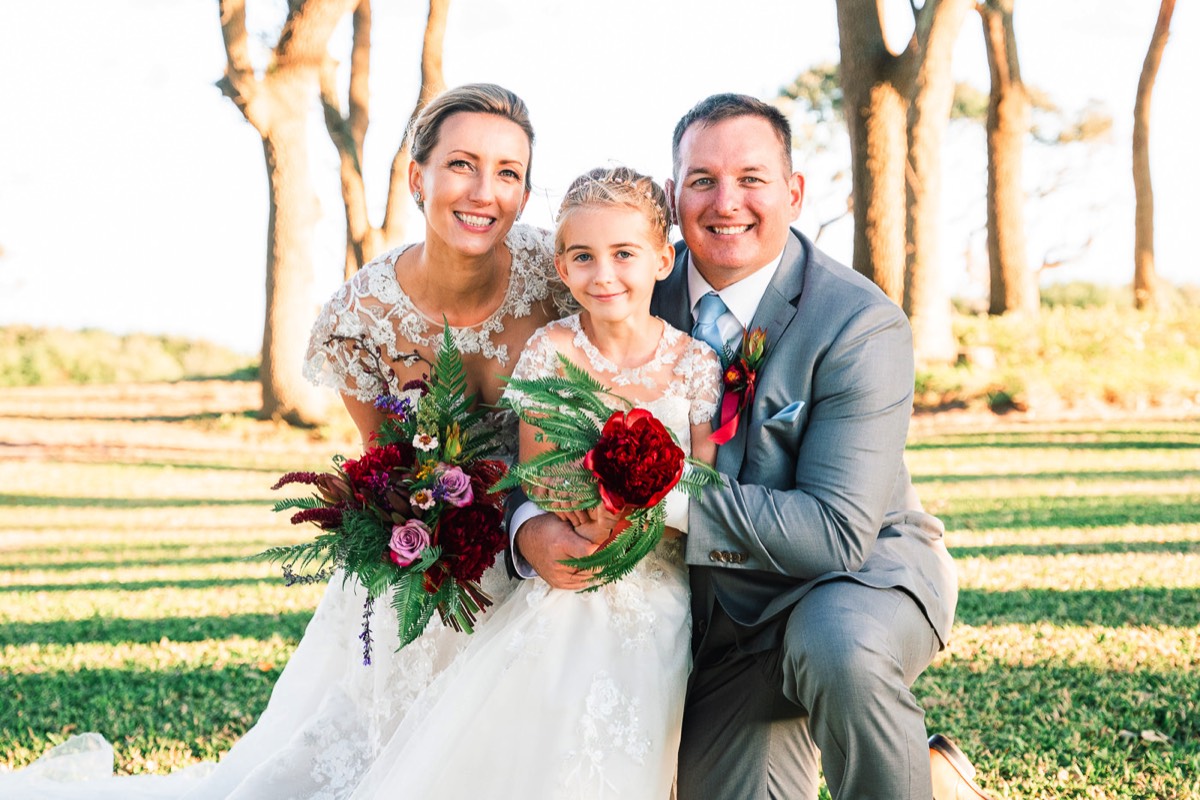 Fort Fisher Wedding - Ft Fisher Wedding Flower girl with bride and groom  -  outdoor weddings -   Fort Fisher North Carolina -  Wedding Photography - Wedding Ideas - Bride - Groom - Wedding Dress - Chris Lang Photography- Popular wedding location - 