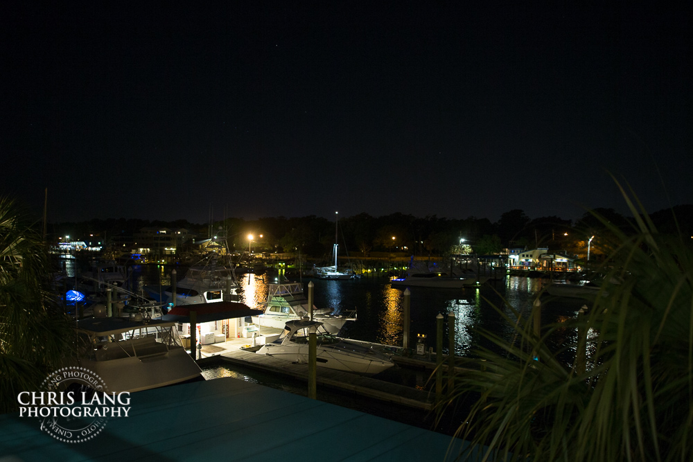 nighttime image overlooking the marina at blue water grill in wrightsville beach - nc