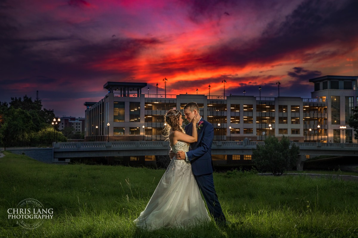 Amazing twilight picture of bride and groom - Sunset - brilliant colors in the sky - wedding photo inspiration - brooklyn arts center - weddings - wedding venue -  wedding photo - ideas - wilmington nc - chris lang photography 