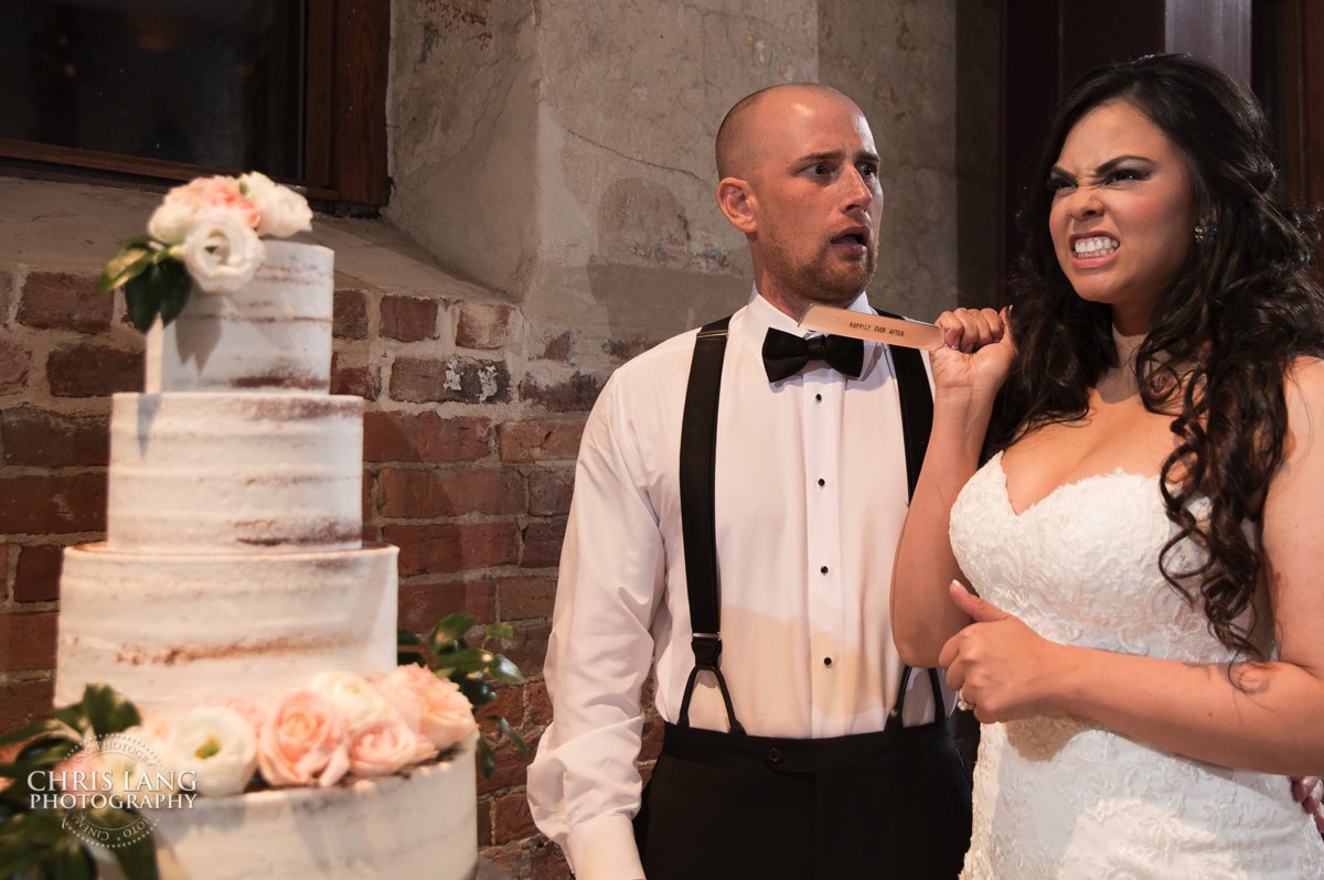 Funny picture of bride and groom cutting cake -  wedding moments - candid wedding picture - brooklyn arts center - weddings - wedding venue -  wedding photo - ideas - wilmington nc - chris lang photography 