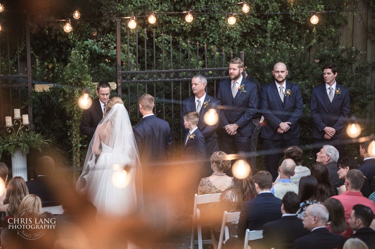 Nighttime wedding - wedding lights - groomsmen - bride and groom at the altar - brooklyn arts center - weddings - wedding venue -  wedding photo - ideas - wilmington nc - chris lang photography 