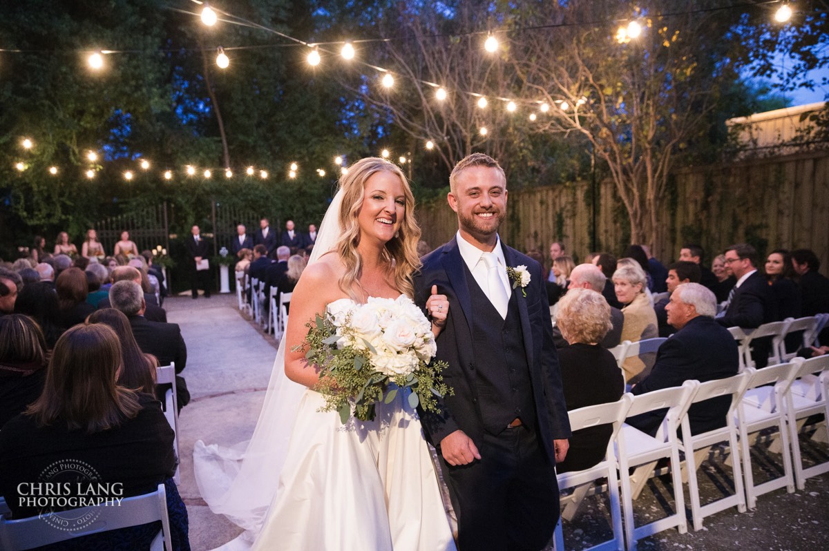 Bride and groom smiling - walking down the aisle - brooklyn arts center - weddings - wedding venue -  wedding photo - ideas - wilmington nc - chris lang photography 