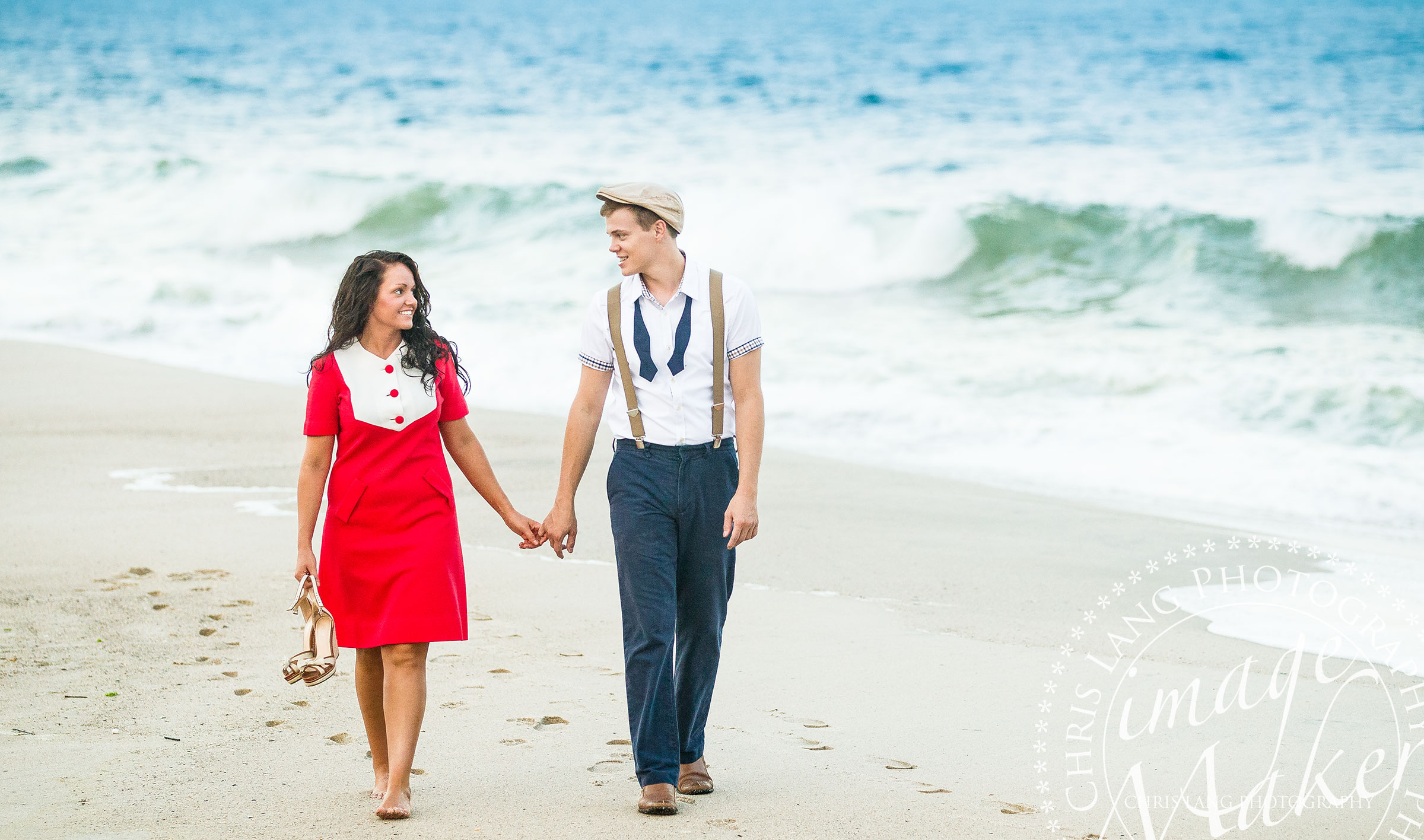 A couple walking on the beach at forst fisher during a vintage style engagment session.  Engaagment picture ideas & inspiration.