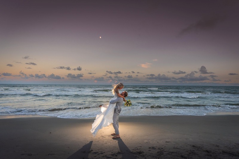 Bride & groom on the beach - Wrightsville beach - Sunset wedding photo - wilmington nc wedding photographer - wedding photo - bride - groom - wedding dres - wedding ideas - chris lang photography