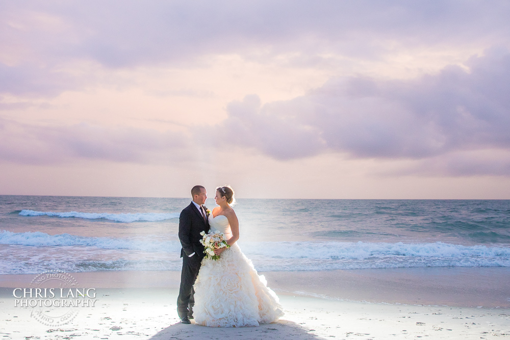 sunset wedding picture on beach - bride & groom - atlantic ocean - wedding dess - beach weddings - beach wedding picture - wedding ideas - beach wedding photography -