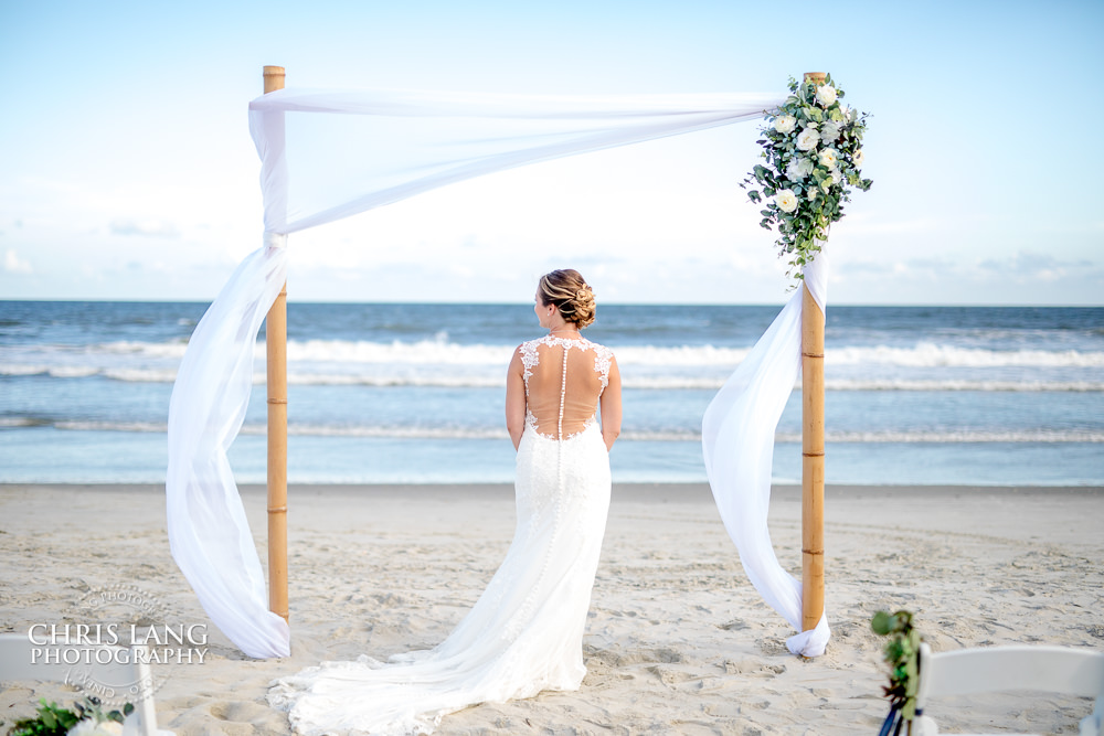 wedding arbor - bride - wedding dress -beach wedding photo - beach wedding picture - wedding ideas - beach wedding photography - Chris Lang Photography - Bride - Wedding Dress - Ocean