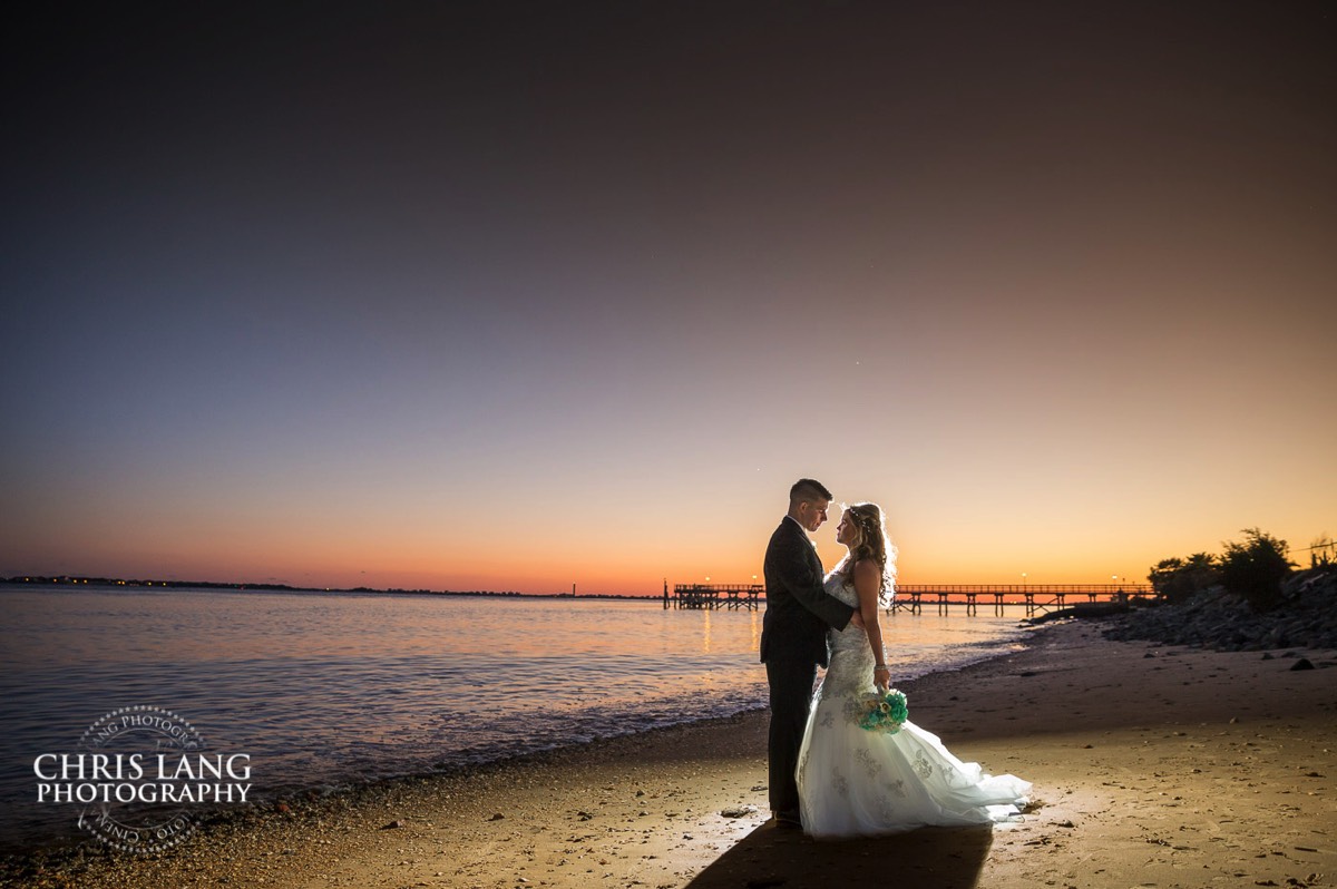 sunset wedding picture - oak island wedding photographers - oak island wedding image - beach wedding photography - beach wedding ideas -