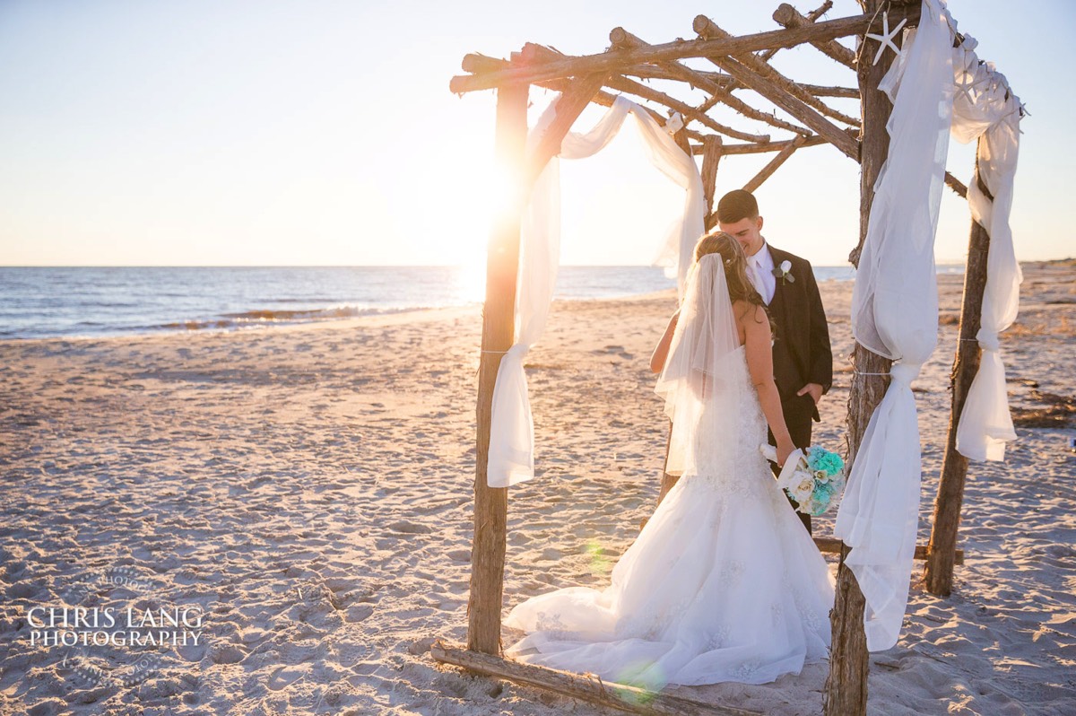 beach bride and groom picture - oak island wedding photographers - oak island wedding image - beach wedding photography - beach wedding ideas -
