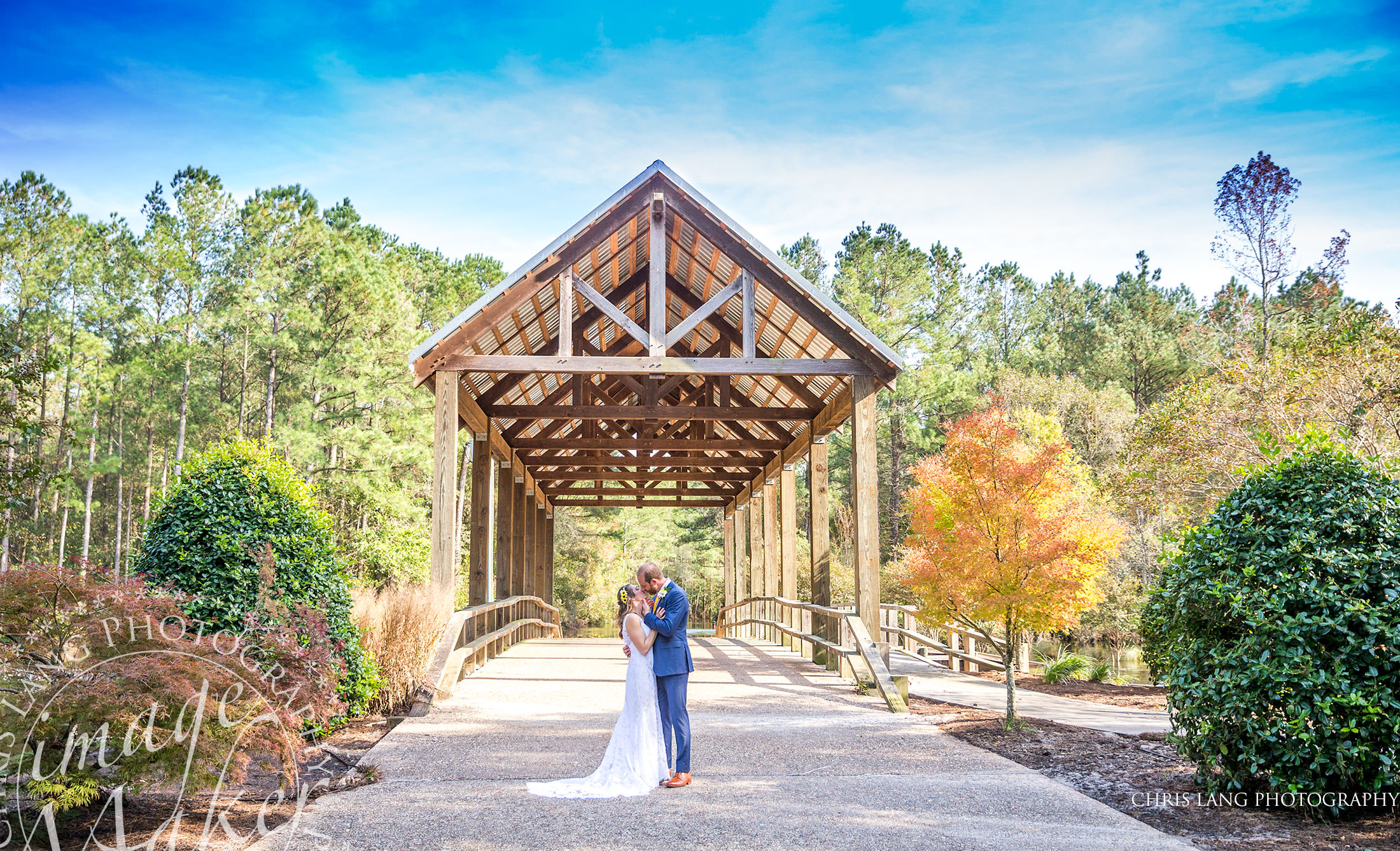 River Landing Weddings - Wallace NC - Image of Bride on the Covered Bridge - River landing Wedding Photographers