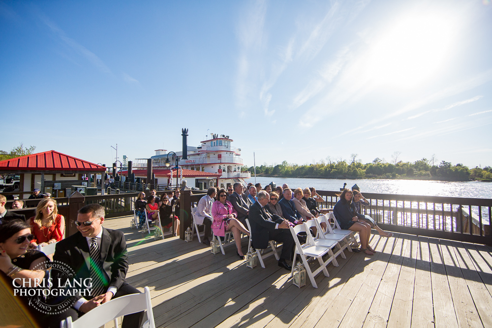 Wedding on the cape fear river deck at the river room in wilmington nc - wedding venues - chris lang photography