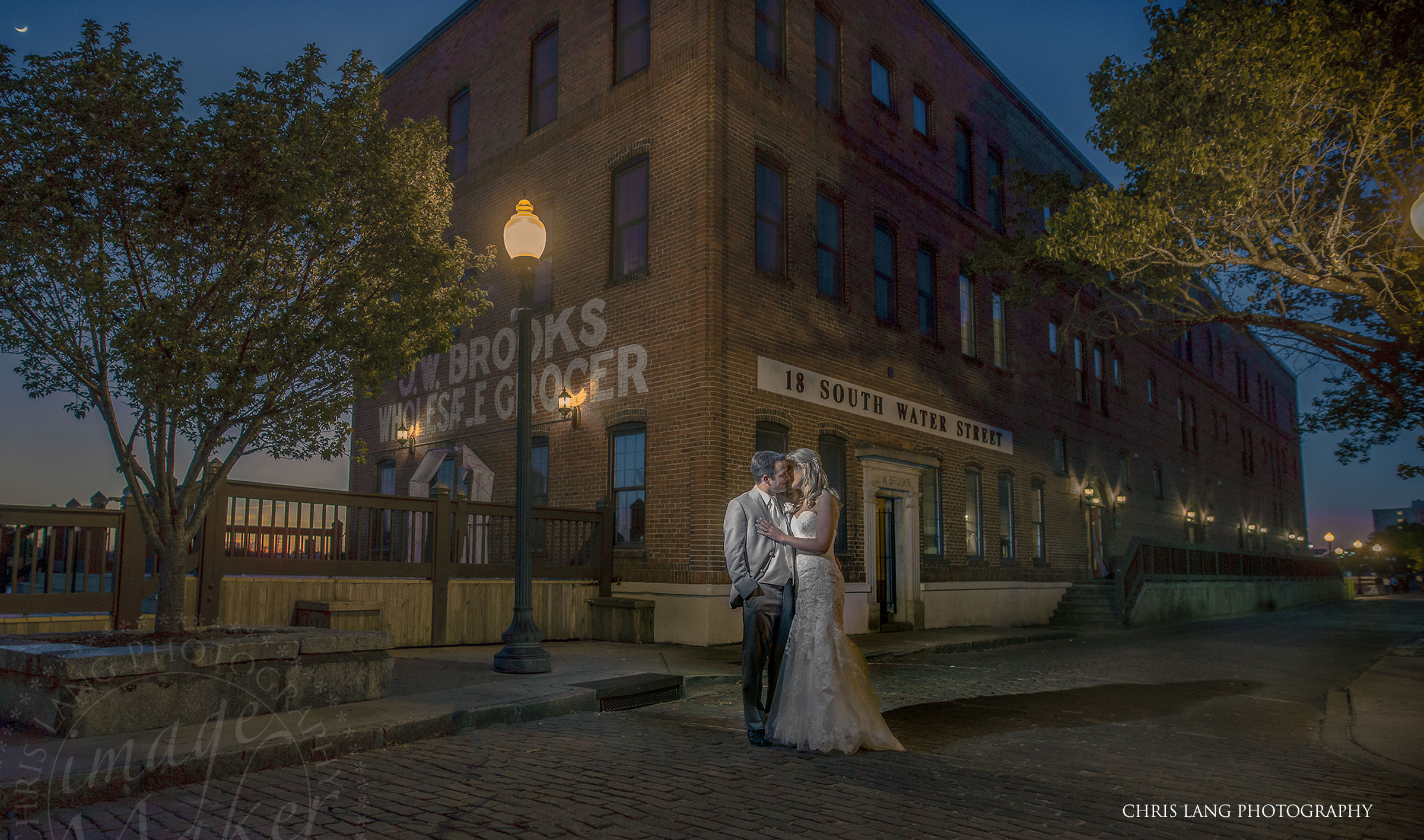 Image of Bride  and groom in front of the River Room on their wedding day - The River Room - Wilmington NC - Wedding Photography - Wedding Venues