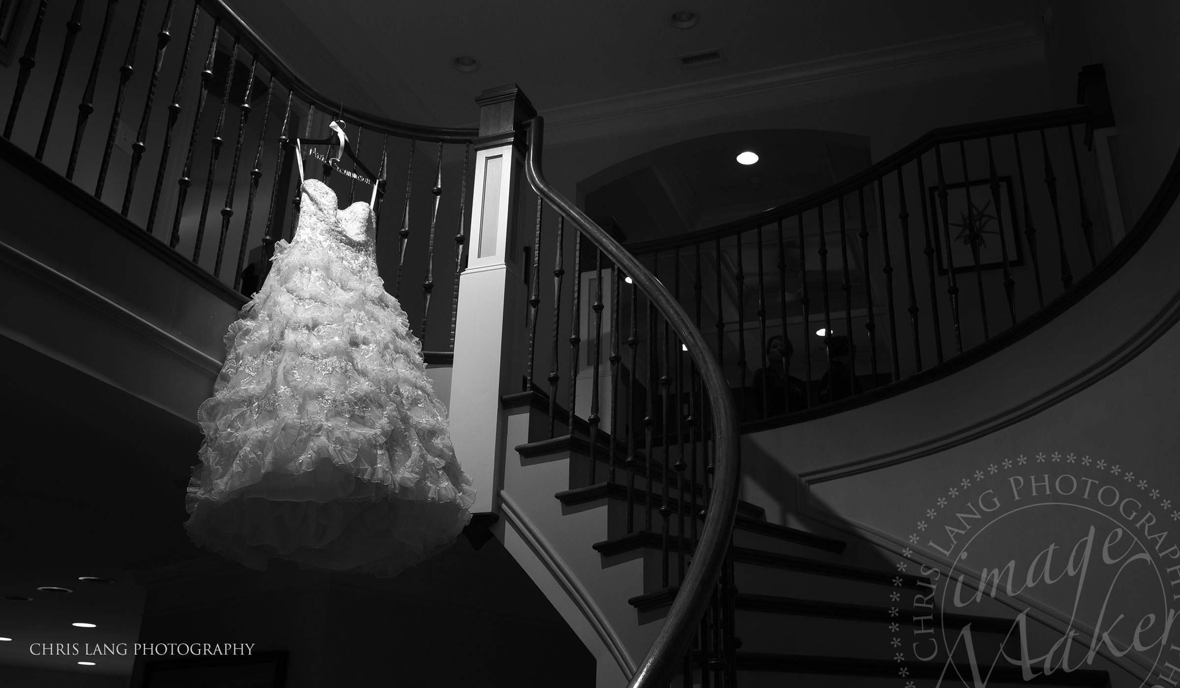 Real Weddings-Featured Wedding in Black and White-Wedding Ideas-Style-Trends-Wilmington NC Wedding Photographers-Wedding dress hanging from Stair case