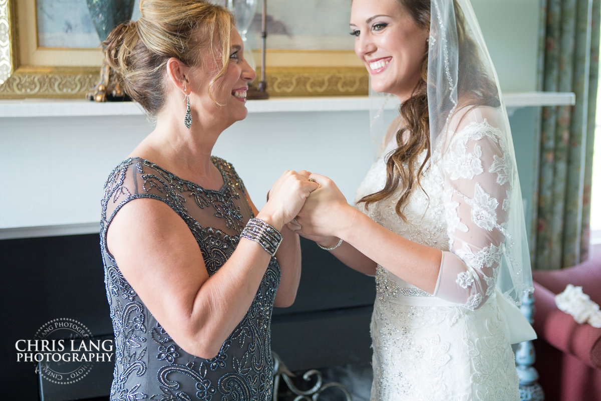 mom and bride sharing pre wedding moment - the city club - wilmington nc - pre wedding photos - wedding photo ideas - getting ready wedding pictures - bride - groom - wedding dress - wedding detail photos - wilmington wedding photography