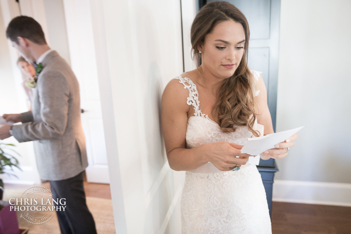 bride and groom reading leeter on opposite side of doors - wedding letters - pre wedding photos - wedding photo ideas - getting ready wedding pictures - bride - groom - wedding dress - wedding detail photos - wilmington nc wedding photography