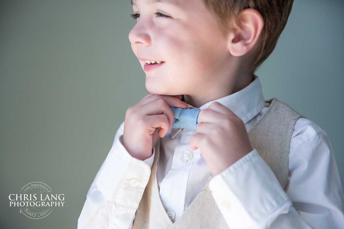 RIng Bearer - Bowtie - Wrightsvlle Manor Weddings - pre wedding photos - wedding photo ideas - getting ready wedding pictures - bride - groom - wedding dress - wilmington nc wedding photography 