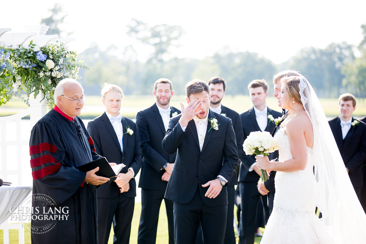 groom lookingat bride during wedding ceremony - wedding ceremony photo - wedding ceremonies - bride - groom - bridal party - wedding ceremony photography - ideas