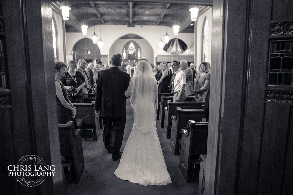 Back of bride walking down the isle - Wedding ceremony photo - Wedding ceremonies - bride - groom - bridal party - wedding ceremony photography - ideas - Wilmingotn NC Wedding Photography