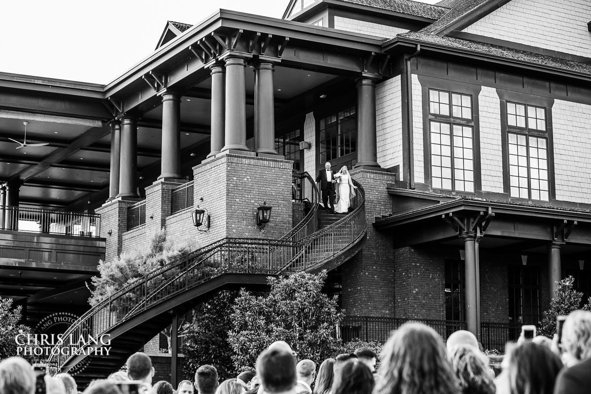 Bride walking down sprial staircase at River Landing - Wedding ceremony photo - Wedding ceremonies - bride - groom - bridal party - wedding ceremony photography - ideas - River Landing Wedings