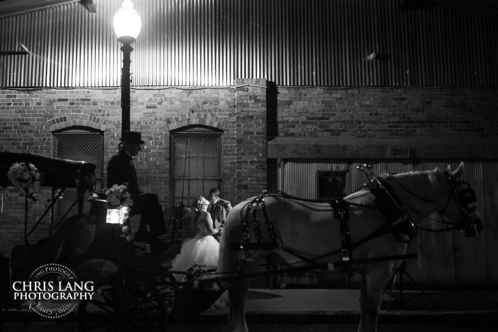 horse and carriage - bride and grrom -  Wilmington wedding photography - night wedding photography - evening wedding photos- bride - groom -  night time wedding photo ideas - low light wedding photography - wilmington nc weding photography