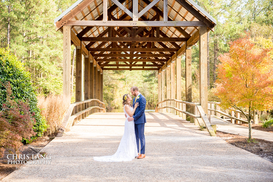 bride-groom-covered bridge - River Landing - natural light wedding photo - wedding photography ideas - Wilmington NC Wedding Photography
