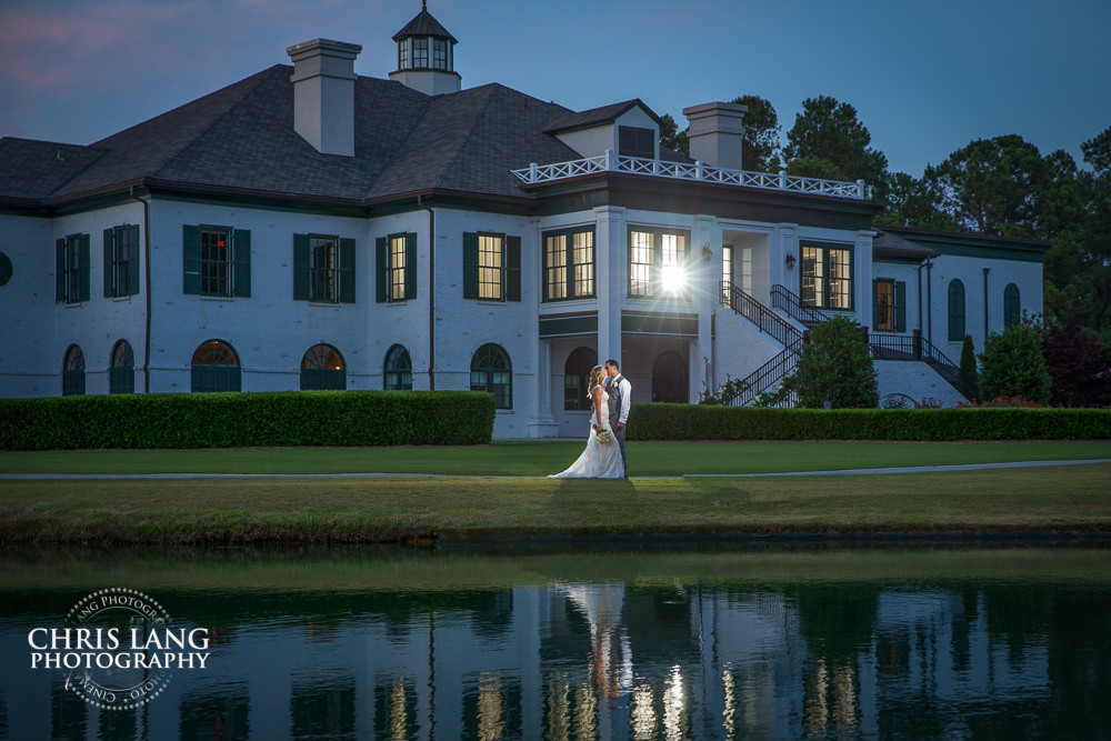 Twilight wedding picture- wilmington nc wedding photography - photographers - bride -groom-wedding dress - romantic moment - Porters Neck County Club 