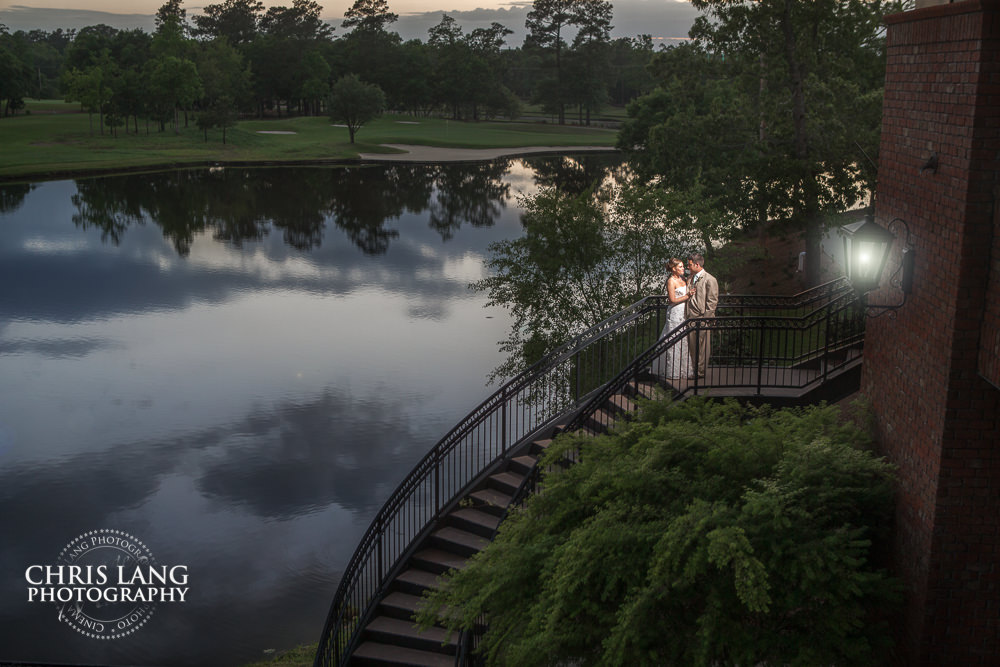 spiral staricase at rivver landing - wallace nc -sunset wedding photo - the golden hour - bride & groom - wedding dress - sunset wedding photography - twlight  - nc wedding photographers