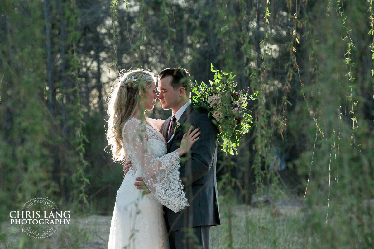 wilmington nc weddings -sunset wedding photo - the golden hour - bride & groom - wedding dress - sunset wedding photography - twlight - willow tree - outdoor wedding ideas