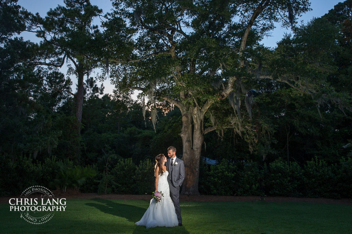 wrightsville manor - wilmington nc - wedding venue - sunset wedding photo - the golden hour - bride & groom - wedding dress - sunset wedding photography - twlight 