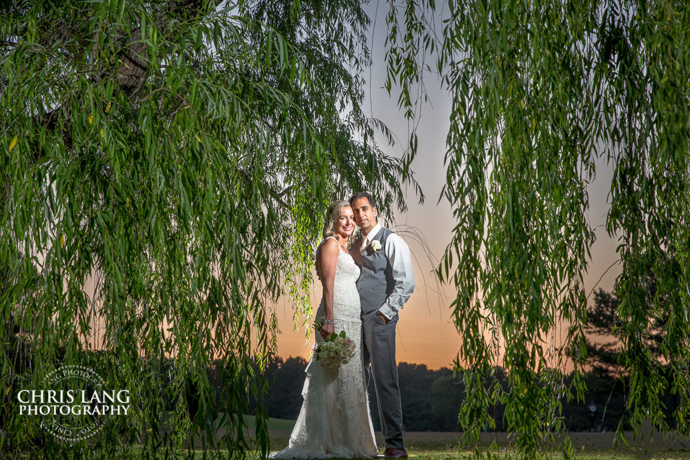 porters neck country club - wilmington weddings sunset wedding photo - the golden hour - bride & groom - wedding dress - sunset wedding photography - twlight 