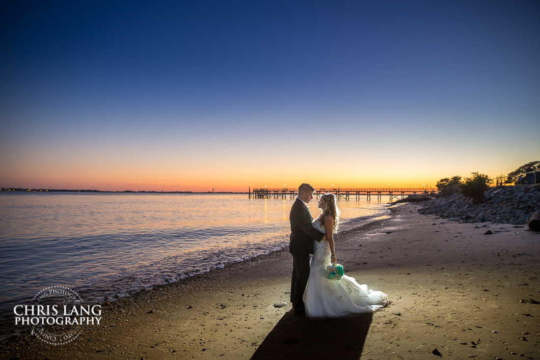 Southport NC weddings - destination weddings - beach weddings - sunset wedding photo - the golden hour - bride & groom - wedding dress - sunset wedding photography - twlight on the beach