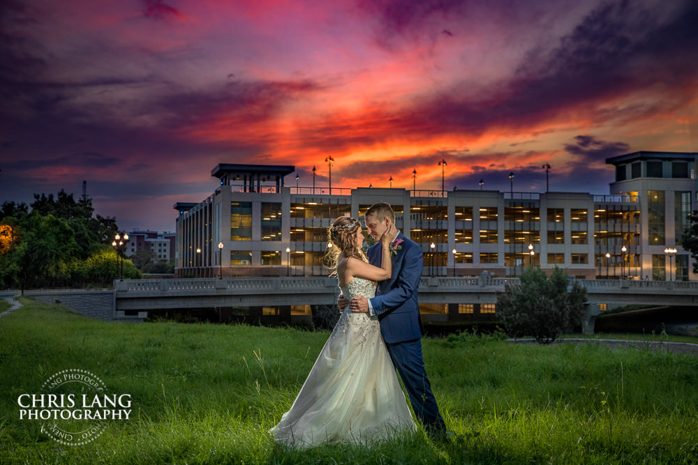 sunset wedding photo - the golden hour - bride & groom - wedding dress - sunset wedding photography - twlight  - Wilminton NC Wedding Photographers