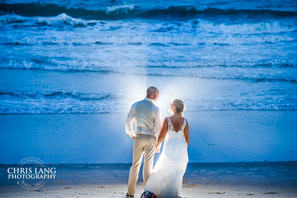 beach wedding photography - beach weddings - sunset wedding photo - the golden hour - bride & groom - wedding dress - sunset wedding photography - twlight on the beach - Topsail Island NC Weddings