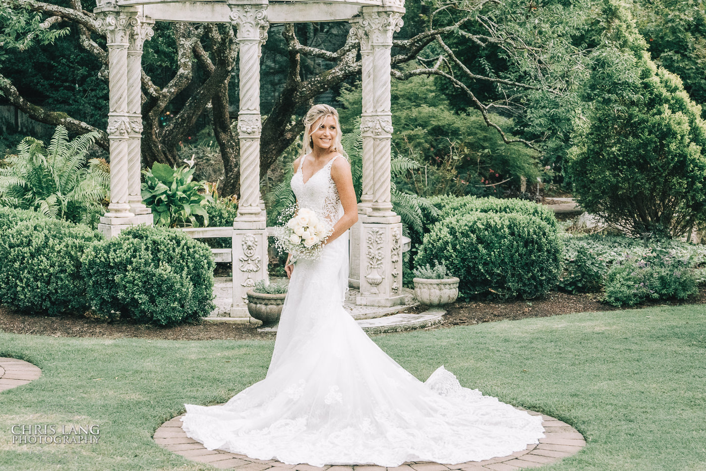 natural light wedding photo - wilmingotn nc wedding photographer - photo of bride - garden wedding portrait - wedding dress - wilmingotn nc wedding photographer - chirs lang photography