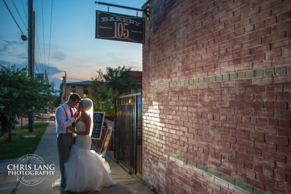 bride and groom outside bakery 105 - wedding venue - wilmington-nc - wedding photo - ideas -