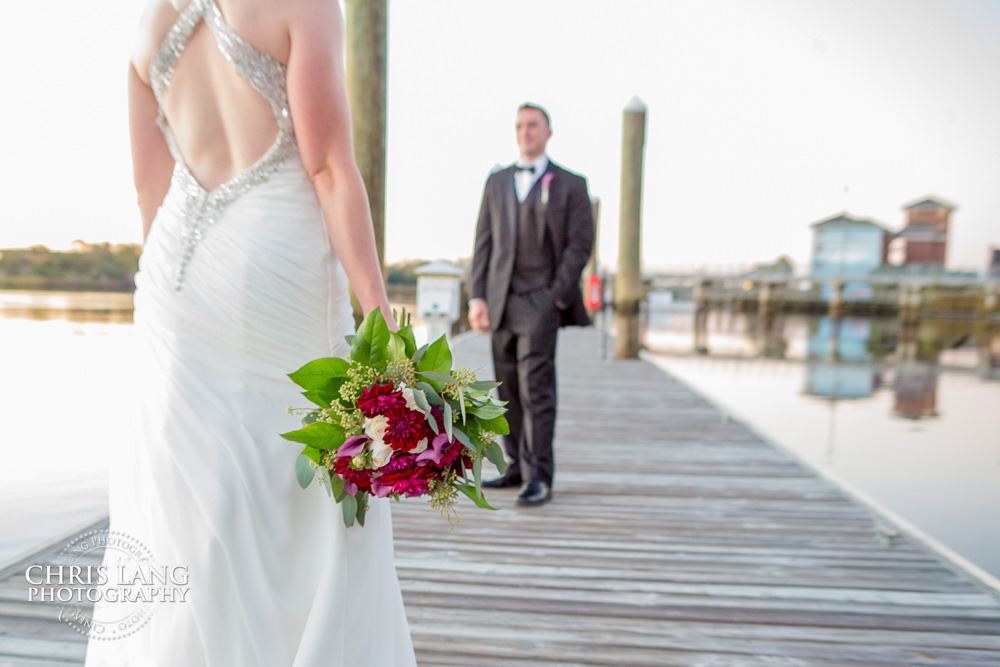 wedding photo at Hotel Ballast - image of bride & groom on Cape Fear Riverfront - wedding day - wilmington nc wedding venue