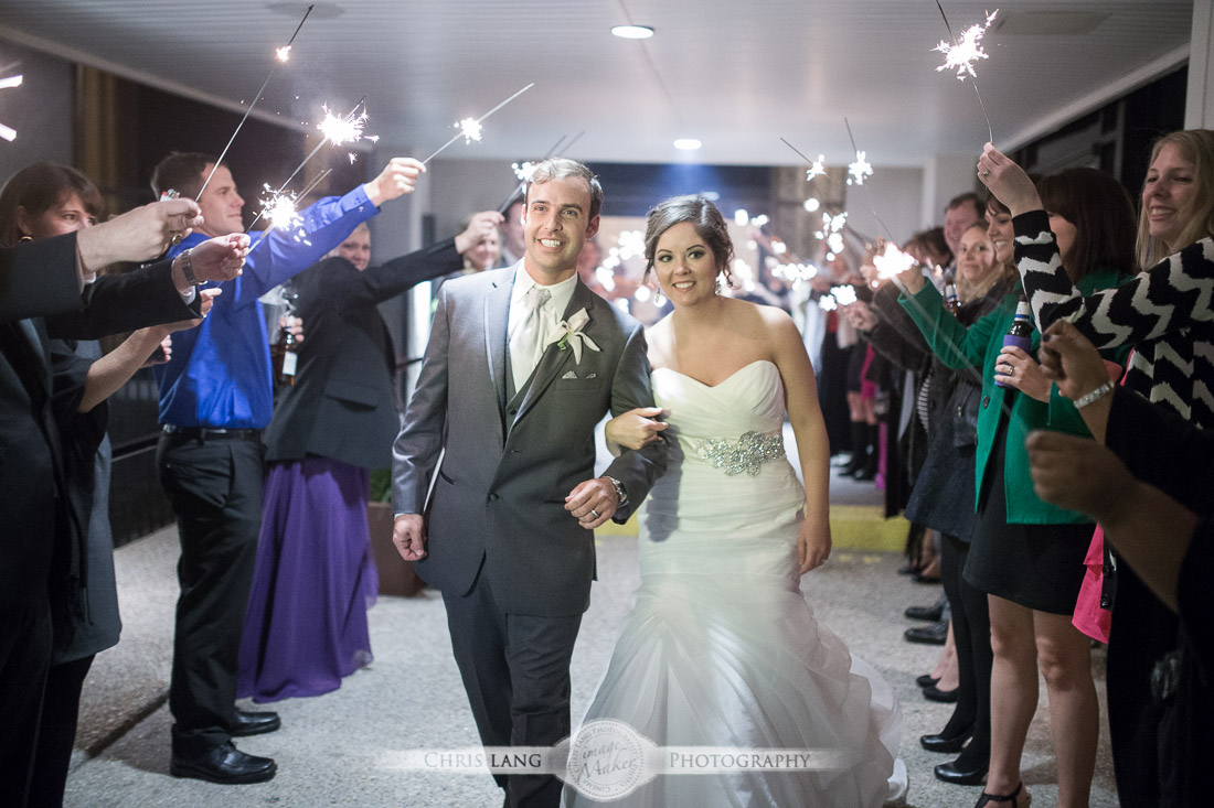bride & groom sparkelr exit at  Hotel Ballast in WIlmington NC - wedding reception picture - chris lang photography - weddign ideas- 